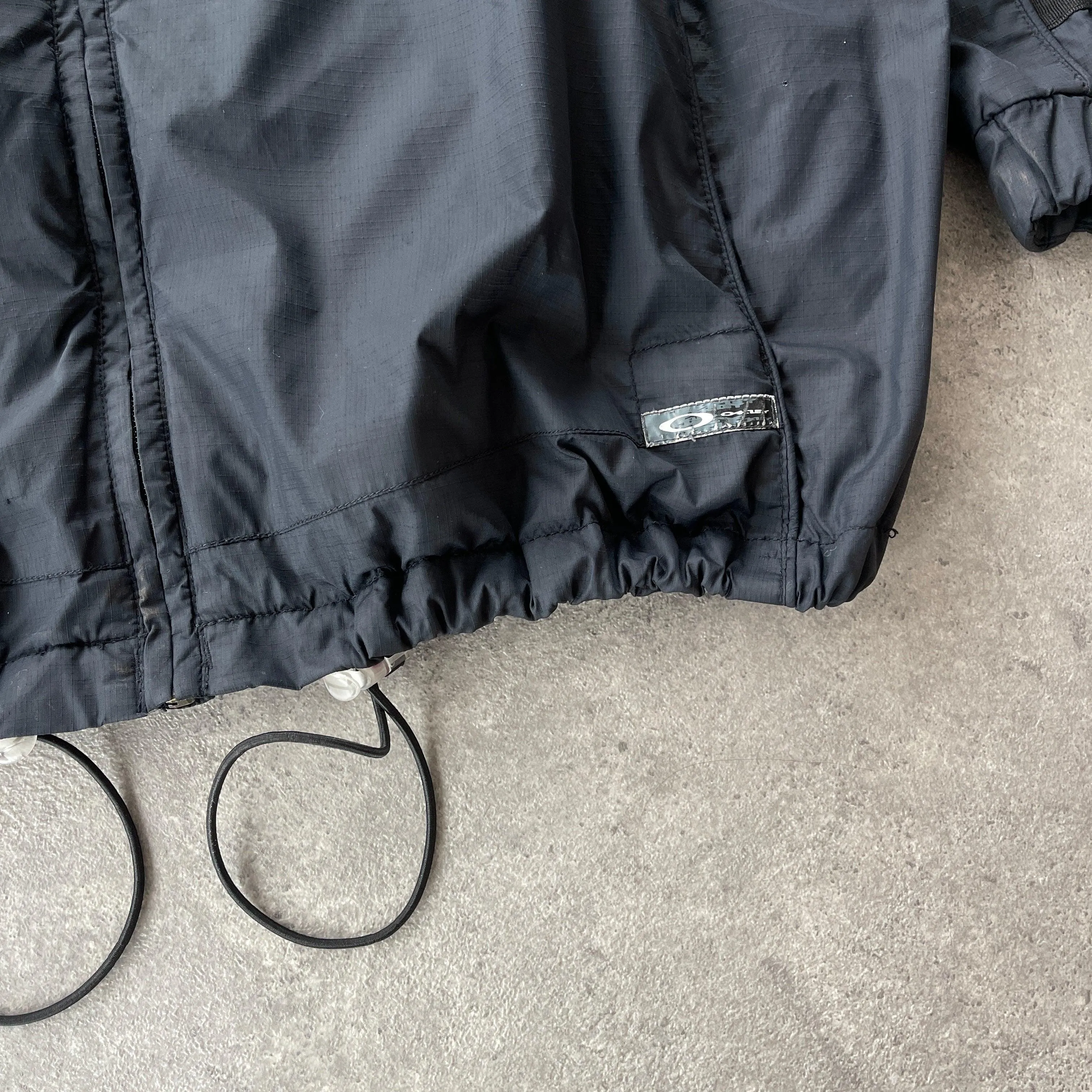 Oakley 2000s technical lightweight spellout jacket (L)